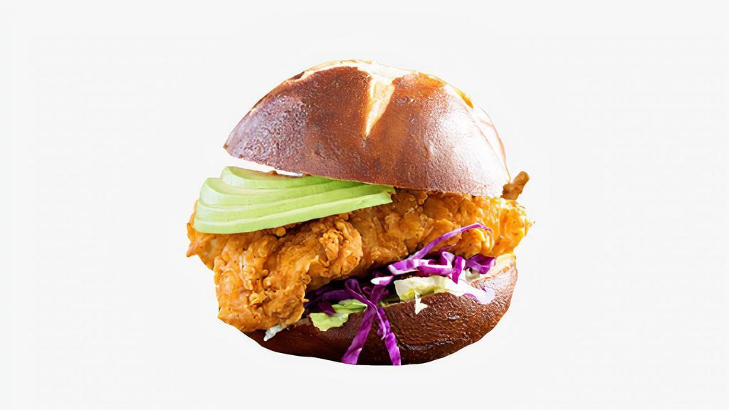 Cali-Style Fried Chicken Sandwich · Buttermilk fried chicken sandwich with avocado, lettuce, tomato, grilled onions, Swiss cheese and honey mustard. Served with fries.