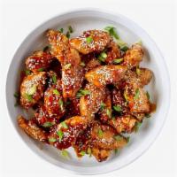 Fried Teriyaki Chicken Wings · Six bone-in wings tossed with teriyaki sauce and topped with sesame seeds and cilantro.