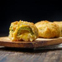 Jalapeño Poppers · Golden deep-fried jalapeños filled with cream cheese.