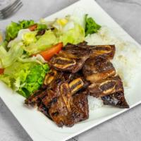 BBQ Beef Short Ribs · Korean BBQ with rice and salad.