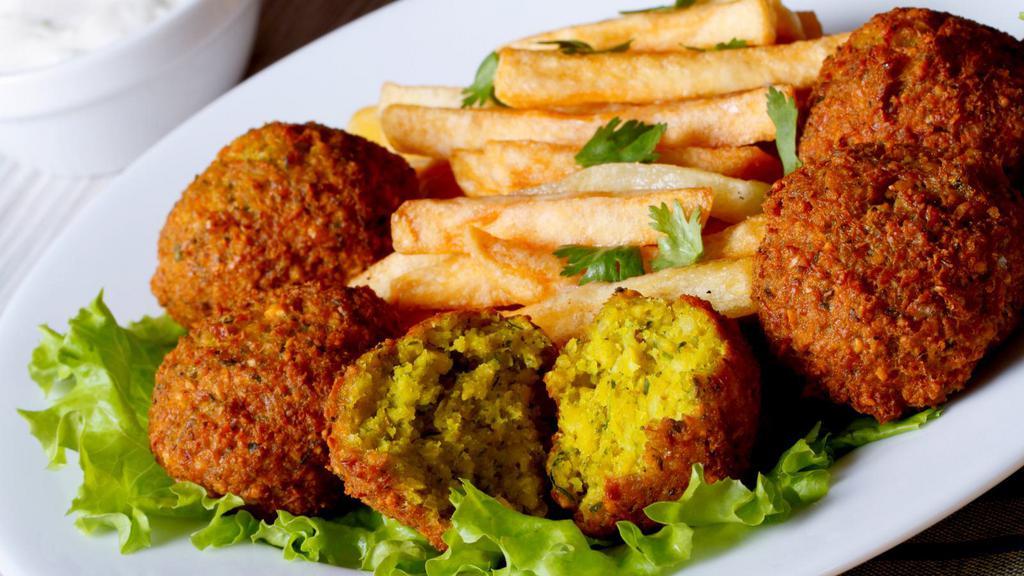 Spicy Vegan Falafels & Fries · Cupertino's famous falafel balls made with crispy chickeas flavored in house-made spices and fried over a bed of crispy golden French fries.