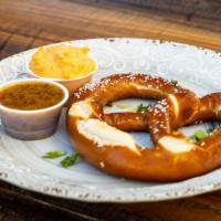 Warm Soft Pretzel · With cheese pimento and mustard dips.