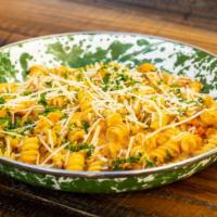Fusilli Pasta · With creamy pork ragu, diced carrots, onions, celery & shredded parmesan cheese.