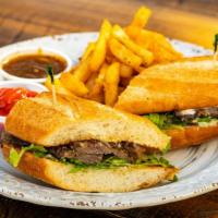 Grilled Tri-Tip Sandwich · Beef tri-tip with horseradish aioli, wild arugula, a red wine onion dipping sauce, served on...