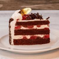 Black Forest | Slice · Chocolate sponge cake with sweet cherries, fresh cream, and decorative chocolate shavings on...