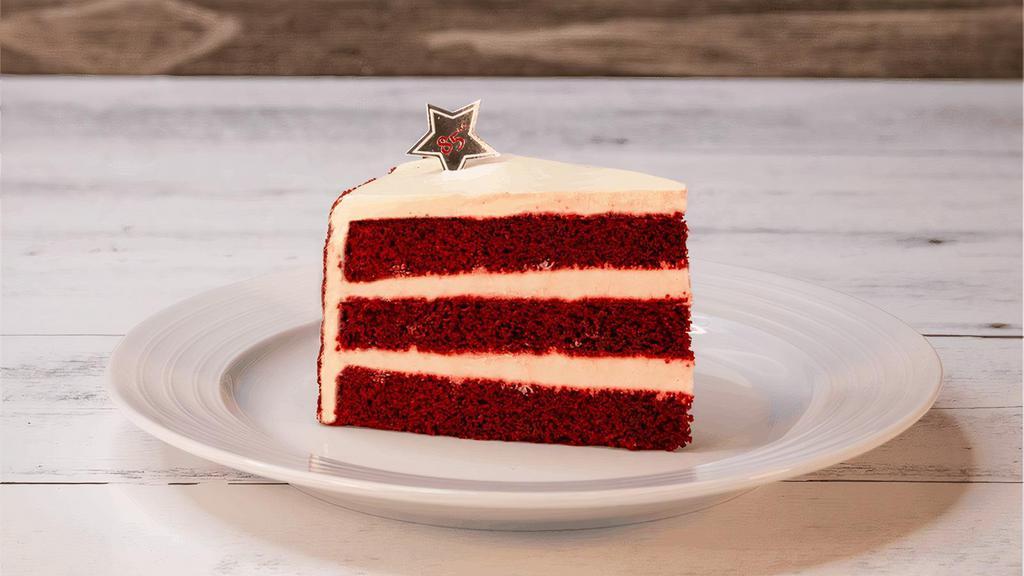 Red Velvet | Slice · Traditional red velvet 3-layered cake with vanilla cream cheese and red velvet crumbs.