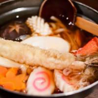 Nabeyaki (Combo) Udon Soup · Japanese-style soup, prepared with Udon (thick flour noodles), Tempura Mix, Chicken, Gyoza, ...