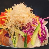 Daikon Salad · Shredded radish with homemade dressing and bonito on top.