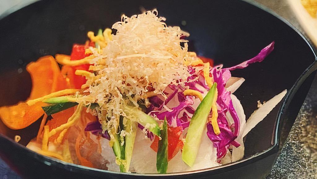 Daikon Salad · Shredded radish with homemade dressing and bonito on top.