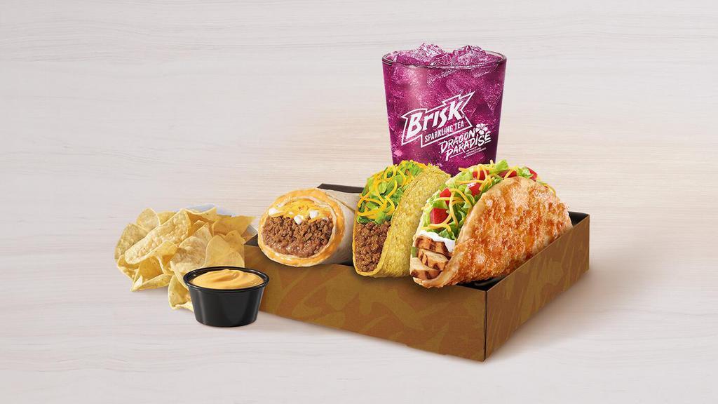 Toasted Cheddar Chalupa Deluxe Box · Includes one Toasted Cheddar Chalupa with grilled, all-white-meat chicken, one Crunchy Taco, chips and nacho cheese sauce, and a medium fountain drink.