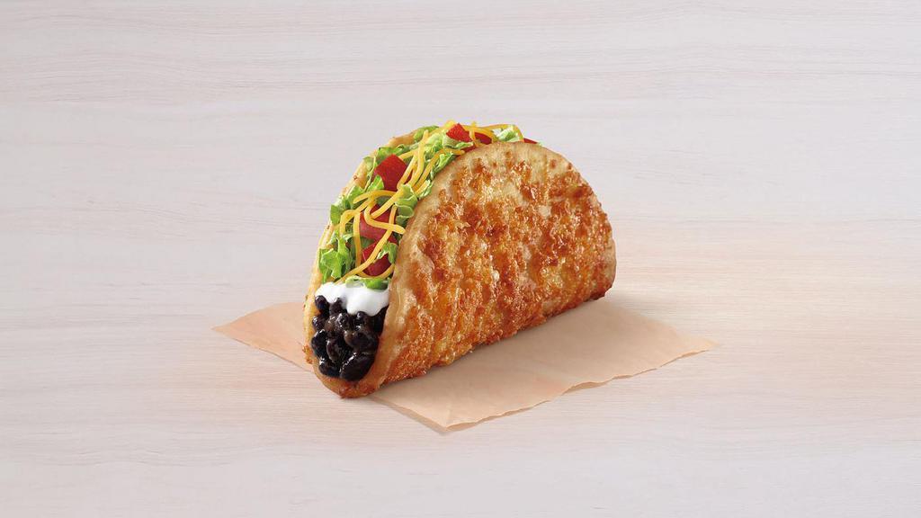 Black Bean Toasted Cheddar Chalupa · A Chalupa shell with 6-month aged cheddar toasted on the outside and with black beans, reduced-fat sour cream, tomatoes, lettuce, and cheddar cheese on the inside.
