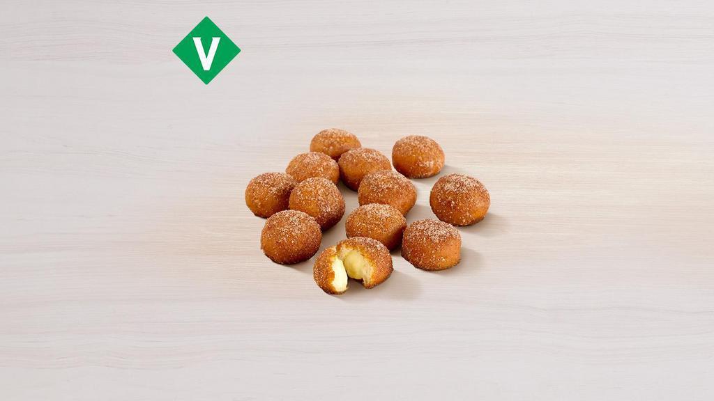 Cinnabon Delights® 12 Pack · Warm donut holes filled with Cinnabon® signature cream cheese frosting, and dusted in Makara Cinnamon sugar.