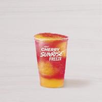 Cherry Sunrise Freeze · A sweet, cherry-flavored Freeze with a tropical swirl of pineapple orange flavor.