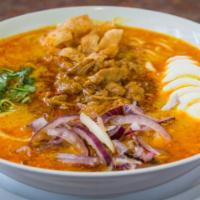 5) Coconut Chicken Noodle Soup · Burmese style coconut noodle soup with chicken, onions, eggs, cilantro, lemon, topped with c...