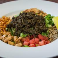7) Myanmar Tea Leaf Salad · Spicy. With romaine lettuce, fried yellow beans, fried garlic, sesame seeds, fresh tomatoes,...