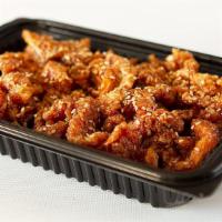 19) Sesame Chicken · Strips of chicken lightly fried in sweet and tangy sauce, topped with a sprinkle of sesame s...