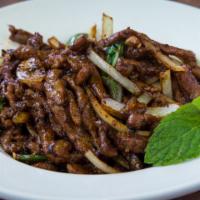 31) Chili Lamb · Spicy. Stir fried lamb with dried and fresh chili, onions, and basil.