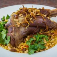 60) Lamb Leg Biryani · Braised lamb leg with fragrant biryani rice, spices, raisins, nuts, mint, cilantro, and frie...
