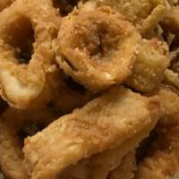 Calamari · Lightly battered rings and tentacles, served w/ cilantro-mayo sauce.
