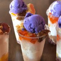 Halo-halo · Mixed tropical fruit and beans topped off with shaved ice, ube ice cream, and caramel.
