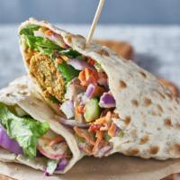 Vegan Spicy Falafel Wrap · Spicy mediterranean wrap with chickpea fritters, lettuce, tomatoes, onions, cucumber based y...
