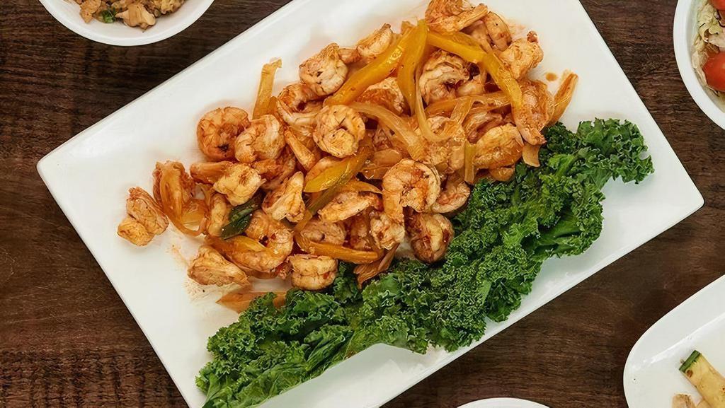Spicy Shrimp  · Hibachi shrimp grilled with onions, scallions and yellow peppers in a spicy homemade sauce.. Available for 2, 4 or 6! . Served with: . - Benihana salad. - Hibachi vegetables . - Homemade dipping sauces. - Hibachi chicken rice