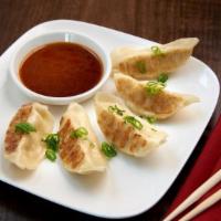 Spicy Chicken Gyoza Dumplings · Spicy sesame soy dipping sauce.