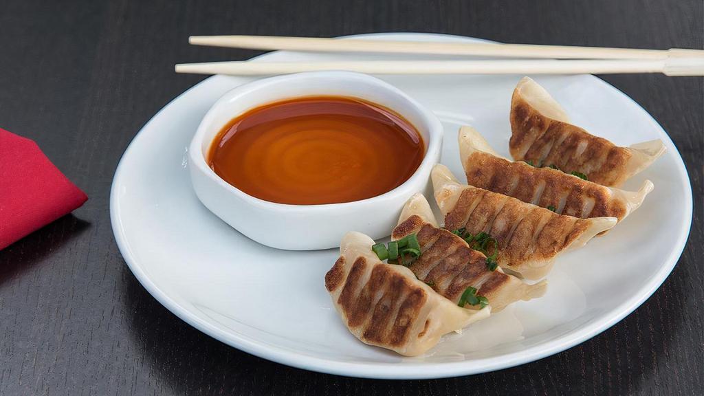 Pan Fried Beef Gyoza Dumplings · Spicy sesame soy dipping sauce.