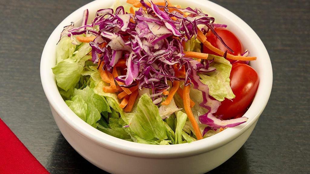 Benihana Salad · Crisp greens, red cabbage, carrots and grape tomatoes in a homemade tangy ginger dressing.