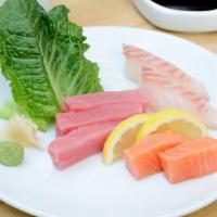 Sashimi* Sampler · Tuna, salmon and snapper.