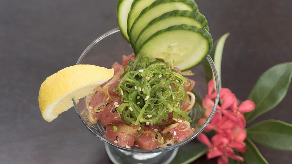 Tuna Poke · Onions, seaweed salad, sweet soy sauce, cucumber and lemon.