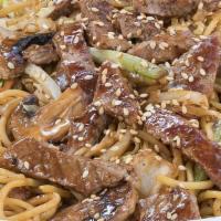 Steak Yakisoba · Japanese sautéed noodles with steak and mixed vegetables in a special sauce and sprinkled wi...
