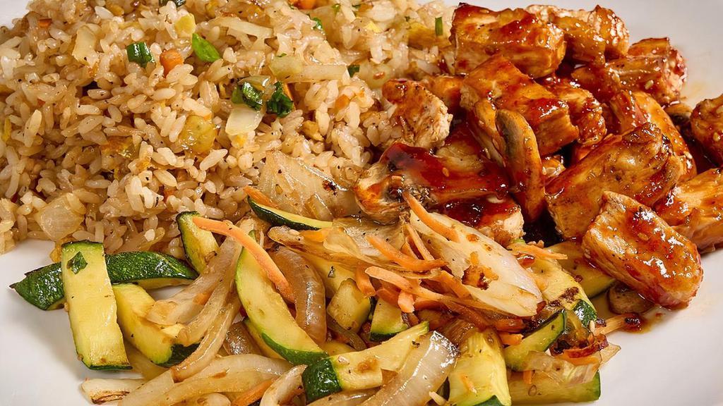 Spicy Hibachi Chicken · Chicken breast grilled with green onions and mushrooms in a special spicy homemade sauce.. 5 course meals served with. •BENIHANA ONION SOUP •BENIHANA SALAD . •HIBACHI SHRIMP APPETIZER •HIBACHI VEGETABLES •HOMEMADE DIPPING SAUCES •STEAMED RICE •JAPANESE HOT GREEN TEA