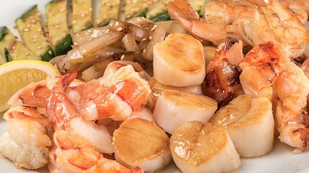 Ocean Treasure · Grilled cold water lobster tail with grilled sea scallops and colossal shrimp.. 5 course meals served with. •BENIHANA ONION SOUP •BENIHANA SALAD . •HIBACHI SHRIMP APPETIZER •HIBACHI VEGETABLES •HOMEMADE DIPPING SAUCES •STEAMED RICE •JAPANESE HOT GREEN TEA