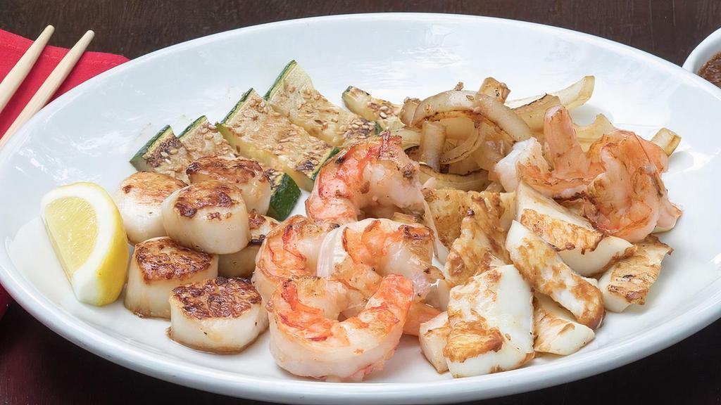 SURF SIDE · Grilled colossal shrimp, calamari and tender sea scallops.. 5 course meals served with. •BENIHANA ONION SOUP •BENIHANA SALAD . •HIBACHI SHRIMP APPETIZER •HIBACHI VEGETABLES •HOMEMADE DIPPING SAUCES •STEAMED RICE •JAPANESE HOT GREEN TEA .