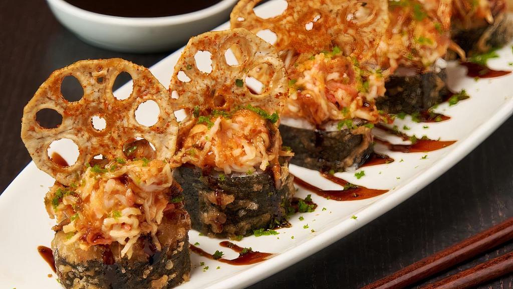 Spicy Lotus Tempura Roll · Krab† and cream cheese rolled in rice and seaweed, lightly tempura battered and topped with spicy tuna, krab† mix and sliced lotus root; finished with sweet eel sauce and green tempura bits. . FOR EVERY PURCHASE OF THIS ITEM, $2 WILL BE DONATED TO ST. JUDE.