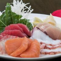 Sashimi* With Rice · Three slices of each: tuna, salmon, yellowtail, snapper, octopus served with steamed rice.
