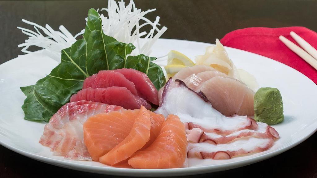 Sashimi* With Rice · Three slices of each: tuna, salmon, yellowtail, snapper, octopus served with steamed rice.