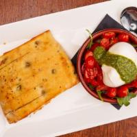 Burrata Bruschetta · Vegetarian. Creamy burrata, pesto, garlic-roasted tomatoes, focaccia.