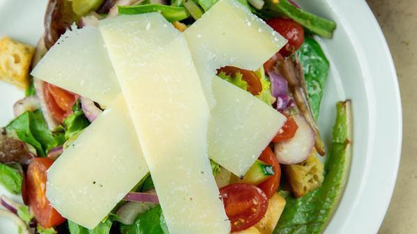 Mixed Greens Salad · Baby greens, parmesan, croutons, cucumber, carrots, grape tomatoes, red onion & your choice of salad dressing