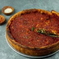 Spinach Pesto Pizza · Fresh spinach, basil garlic parmesan pesto, and homemade tomato sauce. Deep dish pizza toppe...