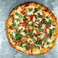 Prosciutto and Arugula Pizza · Aged prosciutto, fresh arugula, mozzarella, extra virgin olive oil, parmesan, and homemade t...