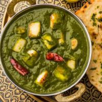 Palak Paneer · Delightful ragout of homemade cheese, cooked with spinach, cinnamon and spices.