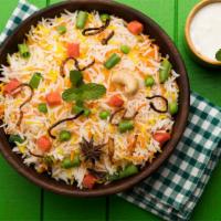 Vegetable Biryani · Garden fresh vegetables cooked with basmati rice in slow fire and serve hot.