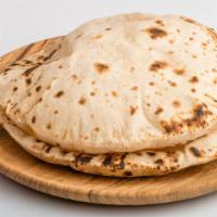 Naan · Fresh bread prepared in a clay oven.