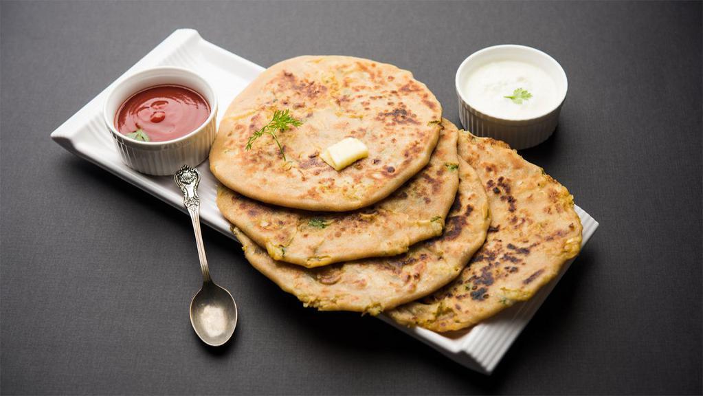 Aloo Naan · Bread stuffed with selected spicy cooked potatoes.