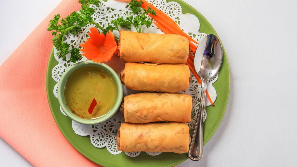 Thai Spring Rolls (4) · Deep fried rolls stuffed with glass noodles, carrots, cabbage, yellow onions and celery served with sweet and sour sauce.
