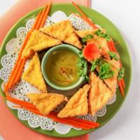 Fried Tofu · Deep fried crispy cubes of tender tofu served with sweet and sour sauce topped with ground p...