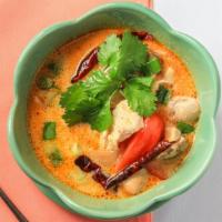 Tom Kha · Chicken broth with lemongrass, galangal as well as mushrooms, tomatoes, lime leaves and gree...