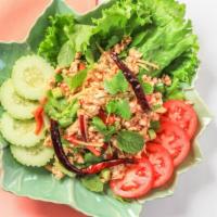 Larb Gai · Mild. Ground chicken spiced with fresh mint leaves, lime juice, red onions, bell peppers, sc...